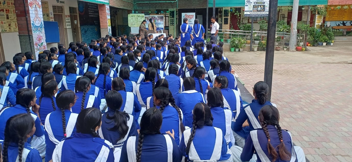 Students listen to a Career Pathway mentorship session at a government girls' school
