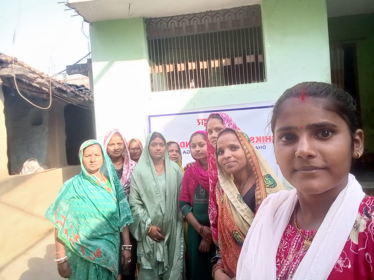 A group of women community members from a Shikshadwar programme area pose confidently together