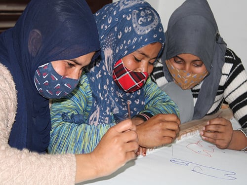 A community member practising embroidery skills in a Shikshadwar livelihood session